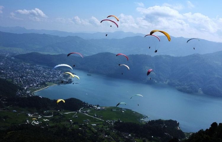 Paragliding Adventure Nepal | Trailblazers Nepal travelers doing paragliding in pokhara with beautiful view