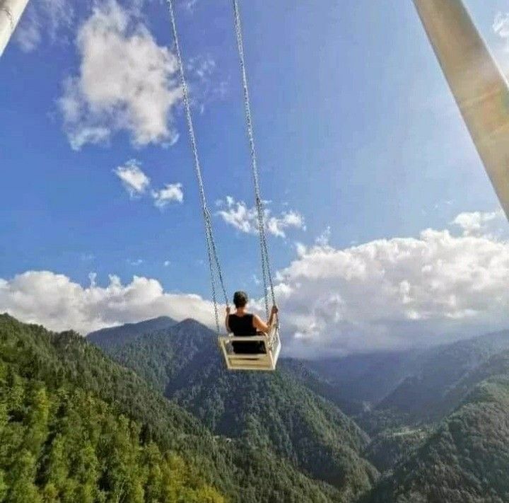 Swing At The Cliff Nepal | Trailblazers Nepal travelers enjoying swing with wonderful view