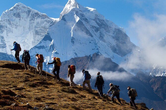 Packing Smart for Your Nepal Trek: Essentials Checklist Trekker hiking through the Himalayas in Nepal with mountain backdrop